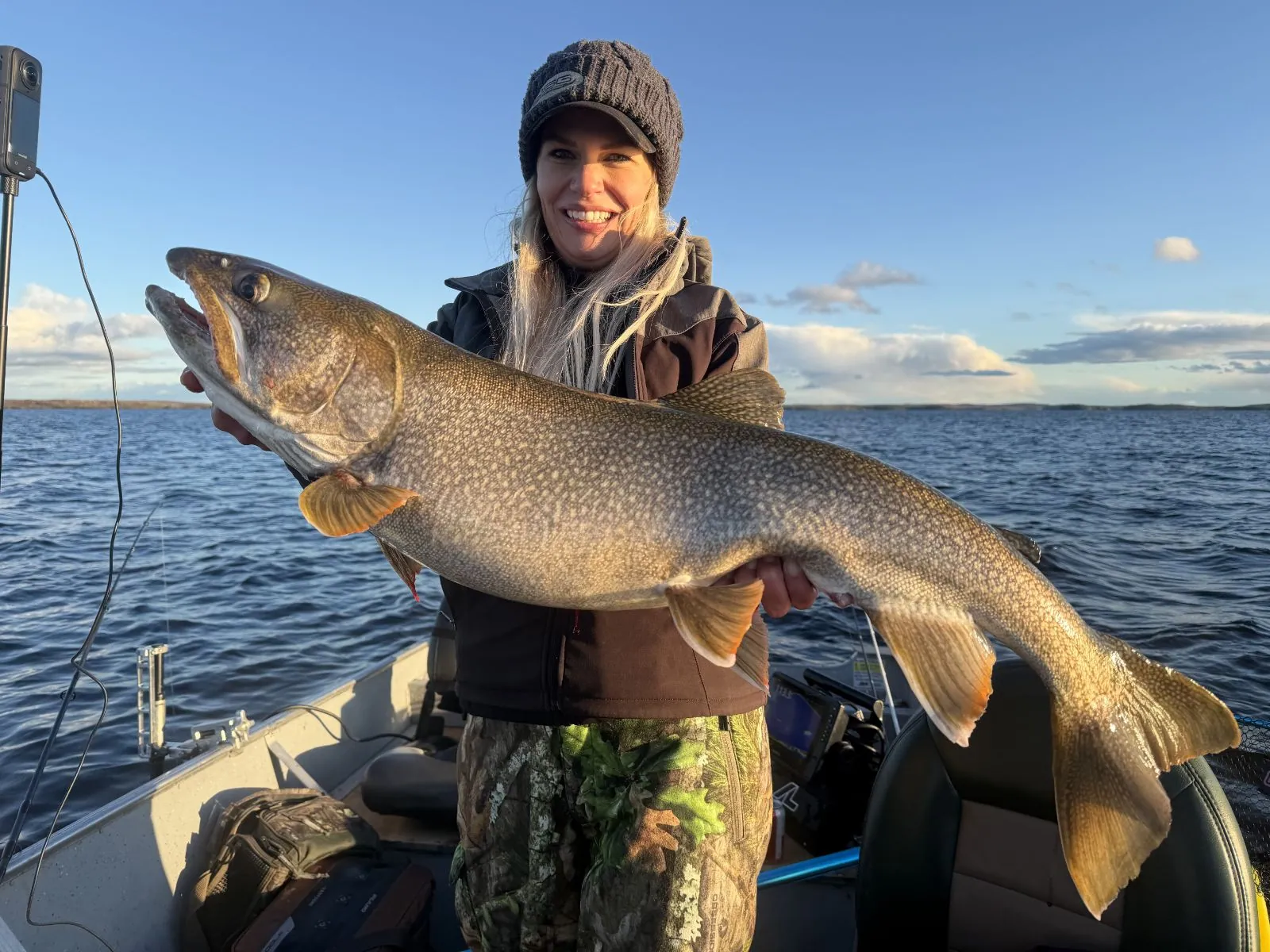 Nicole Stone with a big lake trout on a trophy lake trout fishing trip to Kamuchawie Lake
